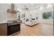 Modern kitchen with stainless steel appliances and marble backsplash at 1073 Mayson Turner Nw Rd, Atlanta, GA 30314