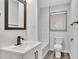 Updated bathroom with white vanity, subway tile, and modern fixtures at 2899 Gresham Se Rd, Atlanta, GA 30316