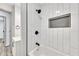 Modern bathroom with white subway tile, a new bathtub, and black fixtures at 2899 Gresham Se Rd, Atlanta, GA 30316