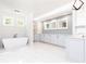 Spa-like bathroom with freestanding tub and large vanity at 340 Colewood Way, Atlanta, GA 30328