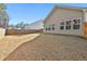 Fenced backyard showcasing a large grassy area at 590 Plainfield St, Fayetteville, GA 30215