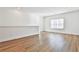 Bonus room with wood-look floors, a window, and a neutral color palette at 590 Plainfield St, Fayetteville, GA 30215