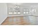 Bright dining room with hardwood floors and large windows at 590 Plainfield St, Fayetteville, GA 30215