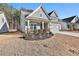 Gray house with stone accents and a 2-car garage at 590 Plainfield St, Fayetteville, GA 30215