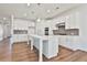 Modern kitchen with white cabinets, stainless steel appliances, and tile backsplash at 590 Plainfield St, Fayetteville, GA 30215