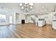 Open living room with hardwood floors, fireplace, and built-in shelving at 590 Plainfield St, Fayetteville, GA 30215