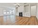 Spacious living room with hardwood floors, fireplace, and built-in shelving at 590 Plainfield St, Fayetteville, GA 30215