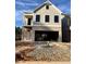 Two-story craftsman style home with gray siding and brick accents at 1074 Crest Mill Dr, Marietta, GA 30008