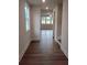 Inviting hallway with wood floors leading to a bright living area with large windows at 1074 Crest Mill Dr, Marietta, GA 30008