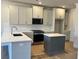Bright kitchen featuring shaker cabinets, stainless steel appliances, and a center island at 1074 Crest Mill Dr, Marietta, GA 30008