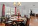 Bright dining room featuring a round wooden table and hardwood floors at 2773 Saddle Horn Pl, Snellville, GA 30039