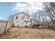 Rear exterior view showcasing the deck and backyard with fence at 2965 Ivy Mill Dr, Buford, GA 30519