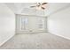 Carpeted main bedroom features trey ceilings and windows for lots of light at 2965 Ivy Mill Dr, Buford, GA 30519