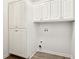 Well-lit laundry room with lots of storage at 2965 Ivy Mill Dr, Buford, GA 30519