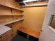 Basement closet with built-in shelves and bench at 75 Briar Patch Rd, Covington, GA 30014