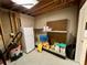 Unfinished basement area with storage shelves at 75 Briar Patch Rd, Covington, GA 30014