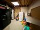 Unfinished basement with shelving and storage at 75 Briar Patch Rd, Covington, GA 30014