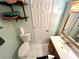 Bathroom with toilet, sink, and wooden vanity at 75 Briar Patch Rd, Covington, GA 30014