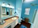 Bathroom with updated vanity, shower, and oval soaking tub at 75 Briar Patch Rd, Covington, GA 30014