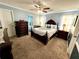 Spacious main bedroom with carpeted floor, ceiling fan and large windows at 75 Briar Patch Rd, Covington, GA 30014