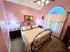 Guest bedroom with carpeted floor and arched window at 75 Briar Patch Rd, Covington, GA 30014