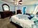 Main bedroom with carpeted floor, ceiling fan and large windows at 75 Briar Patch Rd, Covington, GA 30014