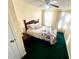 Cozy bedroom with a double bed, green carpet, and window with curtains at 75 Briar Patch Rd, Covington, GA 30014