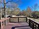 Wooden deck overlooking a wooded backyard at 75 Briar Patch Rd, Covington, GA 30014