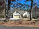 Two-story house with stone accents and garage at 75 Briar Patch Rd, Covington, GA 30014