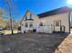 Home's rear exterior with deck and storage at 75 Briar Patch Rd, Covington, GA 30014