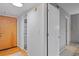 Bright hallway with wood floors, coat closet, and access to other rooms at 3501 Roswell Road Ne Rd # 110, Atlanta, GA 30305