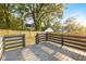 Deck overlooking fenced backyard with mature trees at 358 Roy Sw St, Atlanta, GA 30310