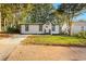 Modern white house with a well-manicured lawn and driveway at 358 Roy Sw St, Atlanta, GA 30310