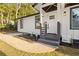 Charming front porch with stylish gray steps, white siding, and freshly landscaped yard at 358 Roy Sw St, Atlanta, GA 30310