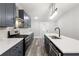 Stylish kitchen featuring dark blue cabinets, stainless steel appliances, and sleek countertops at 358 Roy Sw St, Atlanta, GA 30310