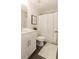 Simple bathroom with white vanity, shower, and toilet at 40 Eryn Ter, Covington, GA 30014