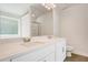 Double vanity bathroom with quartz countertop and large mirror at 40 Eryn Ter, Covington, GA 30014