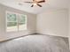 Spacious bedroom with ceiling fan and large window offering natural light at 40 Eryn Ter, Covington, GA 30014