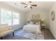 Bright bedroom with queen bed, carpeted floor, and ample natural light at 40 Eryn Ter, Covington, GA 30014