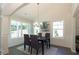 Bright dining room with hardwood floors, chandelier, and large windows at 40 Eryn Ter, Covington, GA 30014