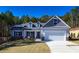 Two-story house with gray siding and white garage door at 40 Eryn Ter, Covington, GA 30014