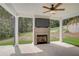 Covered patio featuring an outdoor fireplace and TV at 40 Eryn Ter, Covington, GA 30014