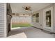 Covered patio with fireplace and ceiling fan at 40 Eryn Ter, Covington, GA 30014