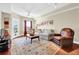 Well-lit living room with wood floors and comfortable seating arrangement at 230 E Ponce De Leon Ave # 516, Decatur, GA 30030