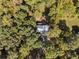 Aerial view of a house with mature trees providing ample privacy, in a leafy neighborhood at 34 Clay Ct, Villa Rica, GA 30180