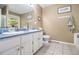 Bathroom features a double sink vanity, a large mirror, and neutral walls at 34 Clay Ct, Villa Rica, GA 30180