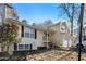 Charming two-story home with light siding and a two-car garage, front yard features a small garden at 34 Clay Ct, Villa Rica, GA 30180