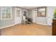 Bright living room featuring wood-look floors, neutral walls, and a large window offering plenty of natural light at 34 Clay Ct, Villa Rica, GA 30180