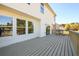 Back of home featuring outdoor wooden deck and large windows at 1188 Pine Acre Dr, Sugar Hill, GA 30518
