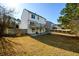 The backyard features a deck and stairs leading to a spacious, well-maintained lawn at 1188 Pine Acre Dr, Sugar Hill, GA 30518